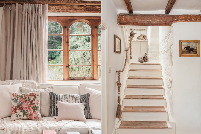 On the left, a white sofa with stone window; on the right, a staircase in a whitewashed hall