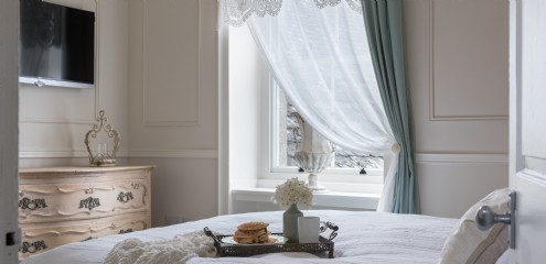 The master bedroom holds a super king-size bed