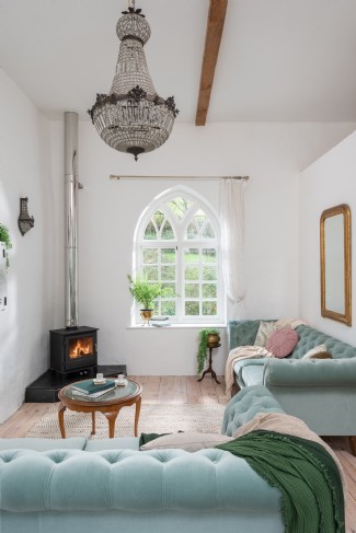 The family television room stays toasty with a woodburner