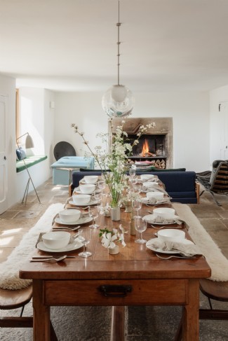 The dining room, complete with roaring log fire
