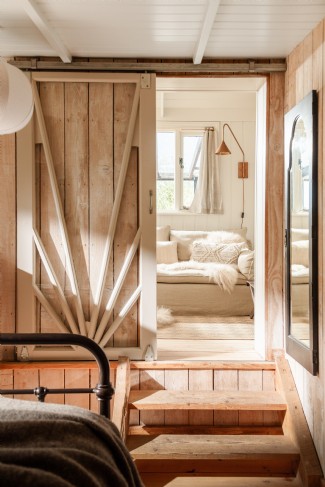 Steps lead down from the sitting room into the bedroom