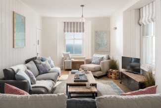 The bright and comfortable living room, perfect for storm watching