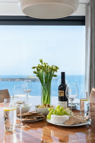 Enjoy a glass of wine overlooking the sea