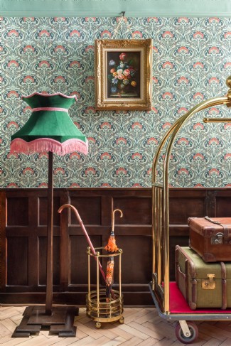 A vintage trolley awaits your holiday luggage in the entrance hall